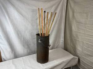 lot 7 image: Tall Bucket w Various Yard Sticks