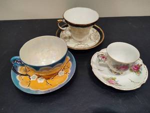 lot 92 image: Three Vintage CupSaucer Sets