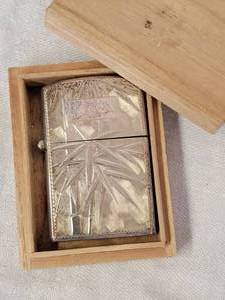 lot 183 image: Japanese Sterling Silver Engraved Lighter Jacket