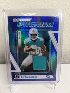 lot 62D image: 2023 Panini Donruss Optic DeVon Achane Blue Hyper Rookie Phenom Jersey Relic RC #RP-DA T