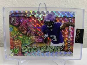 lot 32E image: 2023 Wild Card Alumination Jordan Addison Dino-Might Numbered 115 RC #AD-JA T