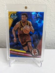 lot 15 image: 2023-24 Bowman University Chrome Bronny James Blue Sapphire RC #95 T