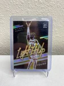 lot 865 image: 2021-22 Panini Donruss Optic Trae Young Light it Up Silver Prizm #3 J
