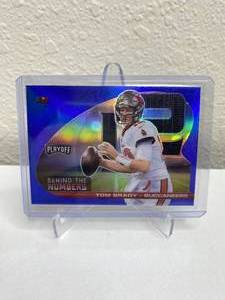 lot 24 image: 2021 Panini Playoff Tom Brady Behind the Numbers Blue Prizm #BTN-TBR J
