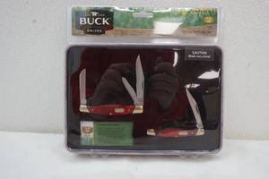 lot 27 image: Buck folding knives in tin