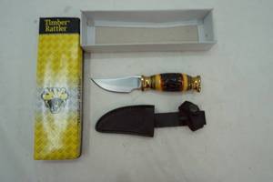 lot 127 image: Timber Rattler fixed blade knife with brass and ornate hilt