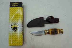 lot 131 image: Timber Rattler fixed blade knife with brass and ornate hilt