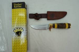 lot 133 image: Timber Rattler fixed blade knife with brass and ornate hilt