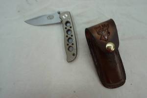 lot 177 image: XPG pocket folding knife with leather sheath