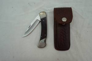 lot 179 image: Pocket knife and leather sheath