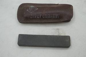 lot 199 image: 3.5 conditioning stone and leather case