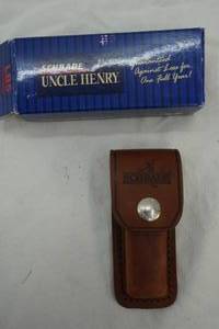 lot 18 image: Schrade Uncle Henry 2.75 folding blade and leather sheath