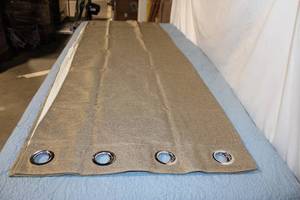 lot 11 image: Heavy-Duty Brown Tarp with Metal Grommets