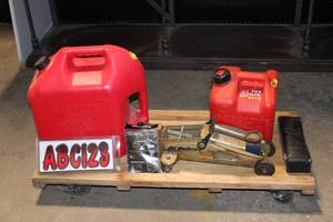 lot 21 image: Set of Gas Cans, Floor Jack, Facemask, and Stickers