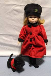 lot 236 image: Collectible Holiday Doll in Red Coat with Black Hat and Dog Accessory