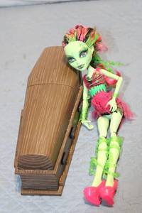 lot 429 image: Monster High Venus McFlytrap Doll with Custom Wooden Coffin Display