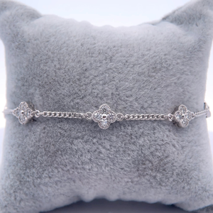 lot 31 image: 1.50 Carat Diamond Four-Petal Flower Cluster Station Bracelet