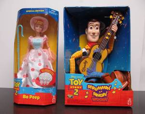 lot 24 image: Mint in Box TOY STORY 2 Toys Strummin & Singin Woody and Bo Peep