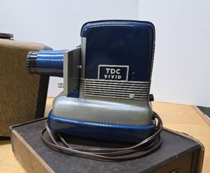 lot 193 image: Very Cool Vintage Blue TDC Vivid Mainliner Slide Projector in Baja Case