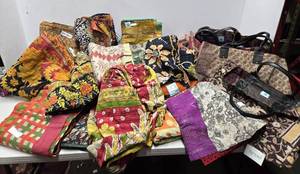 lot 284 image: Fantastic LARGE Lot of Brand New KARMA LIVING Throw Blankets & Bags