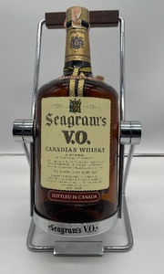lot 69 image: Vintage 1970s Seagrams V.O. Canadian Whiskey 1.75 L Bottle - Empty for Display With Holder