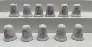 lot 71 image: Eleven Vintage Precious Moments Thimbles