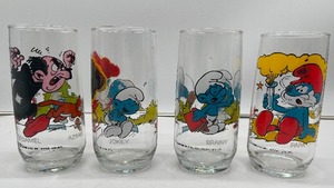 lot 84 image: Four Vintage 1980s Smurf Glasses