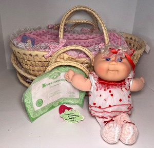 lot 42 image: Cabbage Patch Doll Lindie Antonia with Birth Certificate and Three Rattan Cases New With Tags