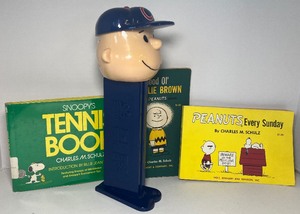 lot 92 image: Three Vintage Peanuts Books and a Large Charlie Brown Peanuts PEZ Dispenser