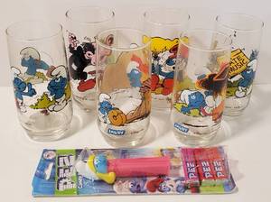lot 101 image: Lot of 7 Piece Smurfs LOT - Six Glasses 1982, PEZ Dispenser (NIP)