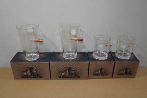 lot 128 image: 4 2nd Amendment Lucky Shot Pint and Whiskey Glasses with Embedded Bullets