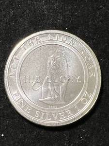 1 TROY OZ .999 FINE SILVER LION ROUND