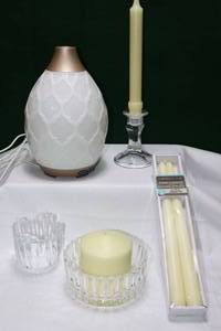 lot 31 image: Young Living Essential Oil Diffuser, Crystal Bowl Taper Votive Candle Holders Candles Etc.