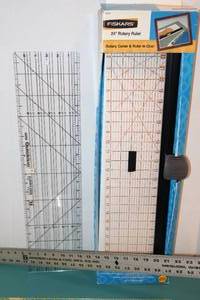 lot 16 image: Sewing Quilting Crafting AccessoriesFiskars 24 Rotary Ruler Cutter, Johnson Level & Tool Mfg. Steel Yard Stick, Cutting Measuring Mats