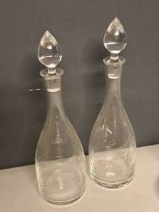 lot 993 image: Lot of (2) 17 Clear Glass Round Wine Decanters with Topper - Merlot, Pinot Noir