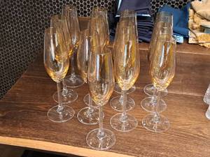 lot 1032 image: Lot of (13) 10 Glass Champagne Flutes (Amber)