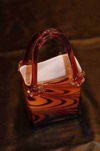 lot 45 image: Handcrafted Glass Purse Vase with Swirl Design