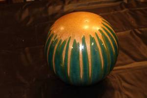 lot 64 image: Decorative Handcrafted Ceramic Sphere with Green and Tan Glaze