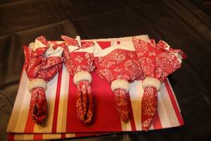lot 97 image: Set of Striped Placemats and Red Napkins with Rings