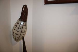 lot 141 image: Unique Floor Lamp with Woven Base and Modern Design Shade