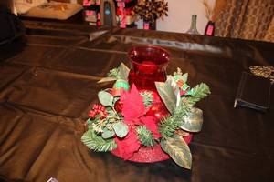 lot 157 image: Red Glass Votive Holder with Holiday Floral Arrangement