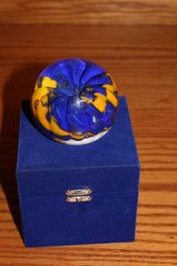 lot 186 image: Hand-Blown Glass Sphere with Blue and Yellow Swirl Design