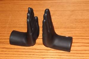 lot 189 image: Pair of Black Resin Decorative Hands Bookends