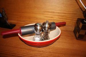 lot 202 image: Kitchen Set with Le Creuset Bowl, Kitchenaid Rolling Pin, and Salt & Pepper Grinders