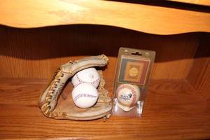 lot 258 image: Baseball Memorabilia Set with Glove, Black Yankees Baseball, and Historical Card