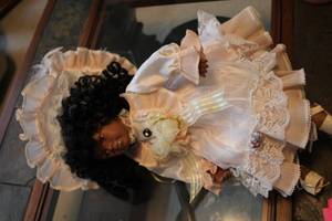 lot 285 image: Porcelain African American Doll in Victorian Dress
