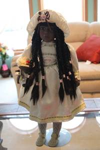 lot 288 image: Vintage African American Doll with Braided Hair and Traditional Dress