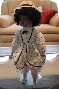 lot 297 image: Vintage Heritage Mint Collection Porcelain Doll in Polka Dot Dress