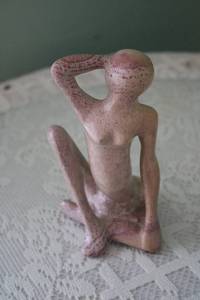 lot 306 image: Artisan Pink Stone Sculpture of Contemplative Figure