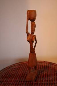 lot 449 image: Hand-Carved Wooden Figurine Woman Carrying Vessel